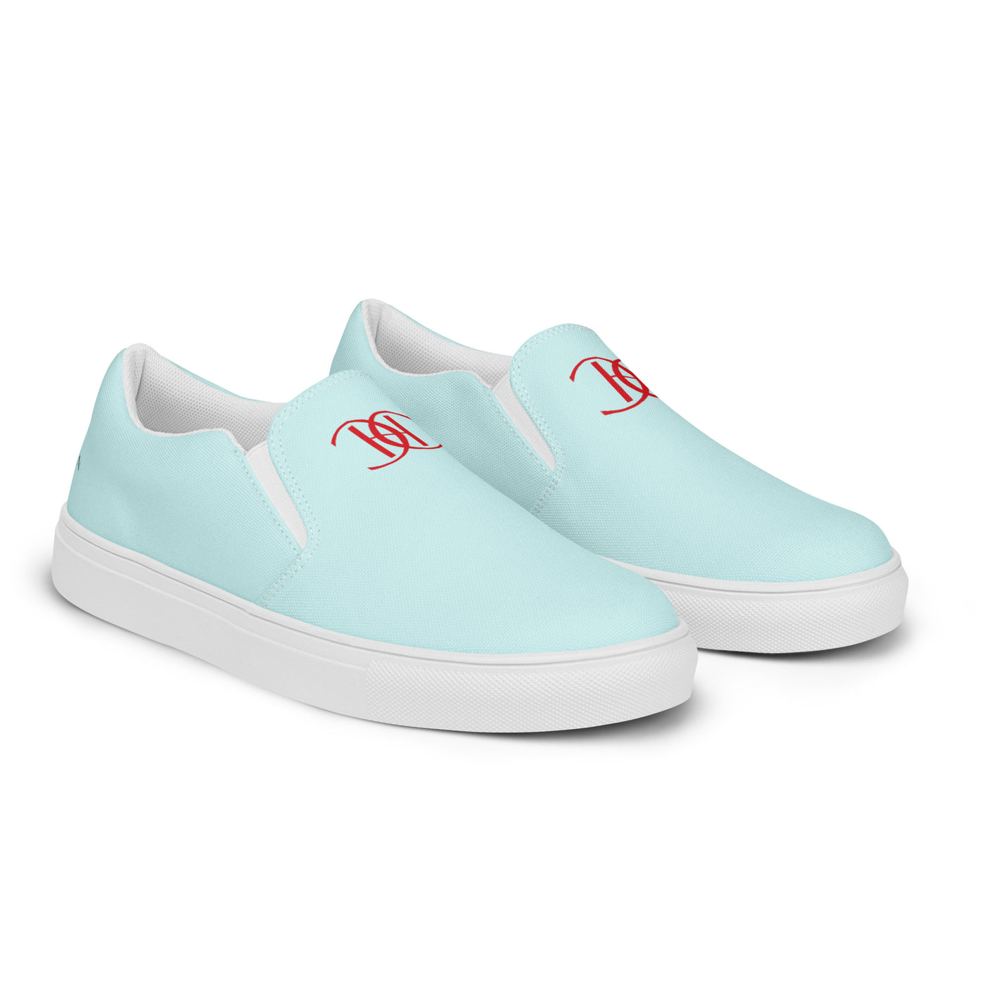 Light blue slip-on canvas shoes with red Cachy’s Urban monogram logo on the upper front and branded insoles