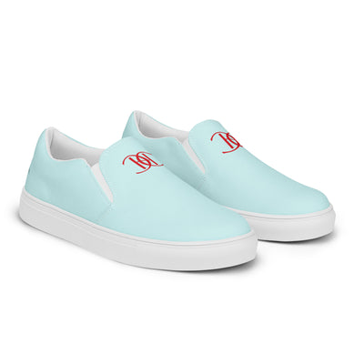 Light blue slip-on canvas shoes with red Cachy’s Urban monogram logo on the upper front and branded insoles
