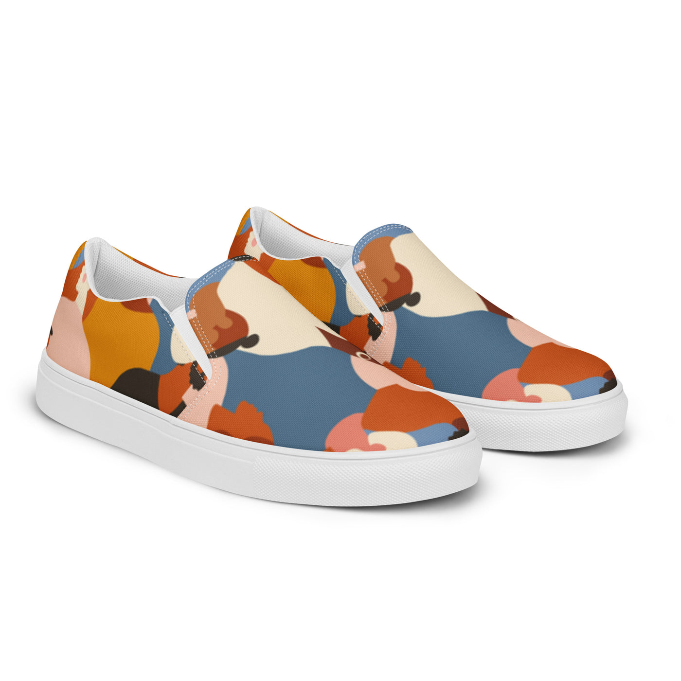 Slip-on canvas shoes with tribal-style multicolor abstract pattern featuring diverse human silhouettes in earthy tones and Cachy’s Urban branded insoles
